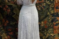 16 heavily beaded lace wedding dress with long sleeves and a V cut back
