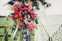 17 macrame hanging, bold florals and antlers for arch decor