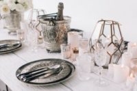18 refined silverware, a candle lantern and plates with white look stunning