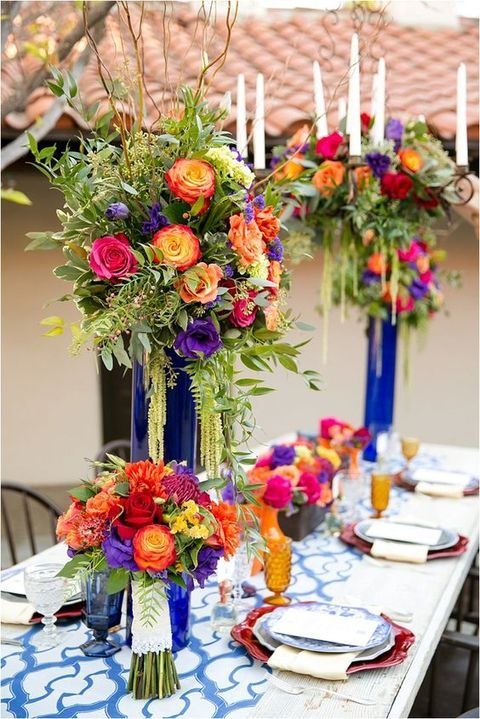 super bold tablescape with large flower arrangements will embrace your location