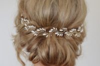 18 twisted bridal updo with a pearl hair vine for an elegant look