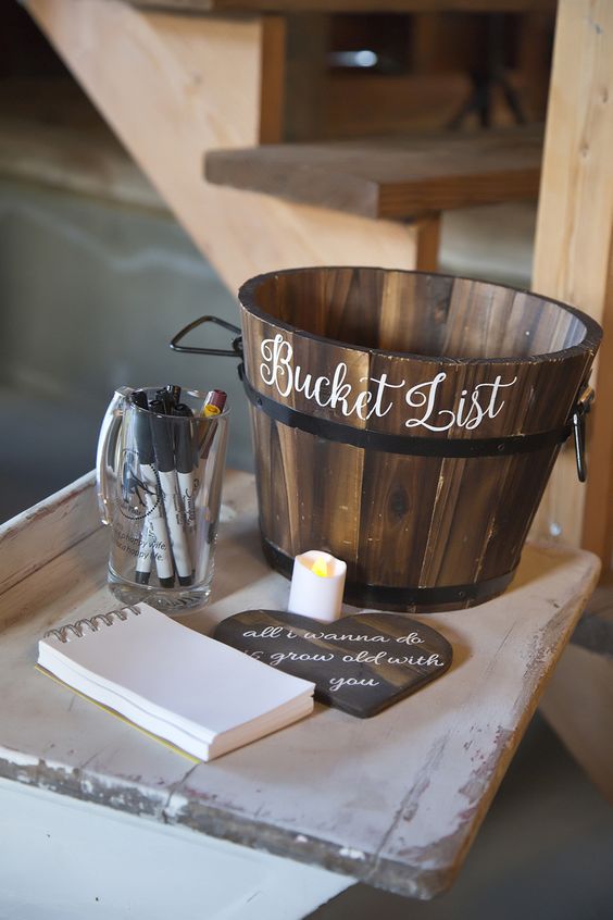 wooden bucket for a bucket list is a unique idea