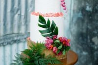 19 a textural white cake with fresh blooms, petals and leaves