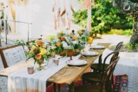 20 colorful wedding table setting with peachy and yellow flowers and anombre table runner
