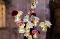 20 hanging flowers in jars are a simple and cute decoration for your venue