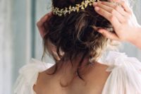 20 messy updo with a sparkling gold hair vine