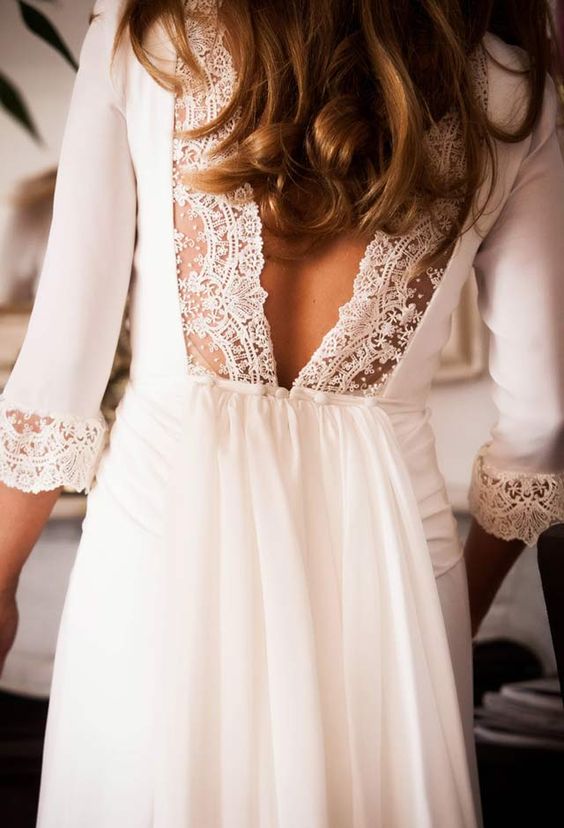 plain wedding dress with half sleeves and a V cut back decorated with lace