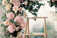 21 lush pink and ivory floral wedding arch is a perfect choice for a summer garden wedding
