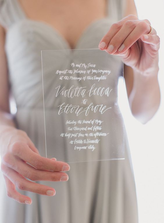 clear wedding menu with white calligraphy