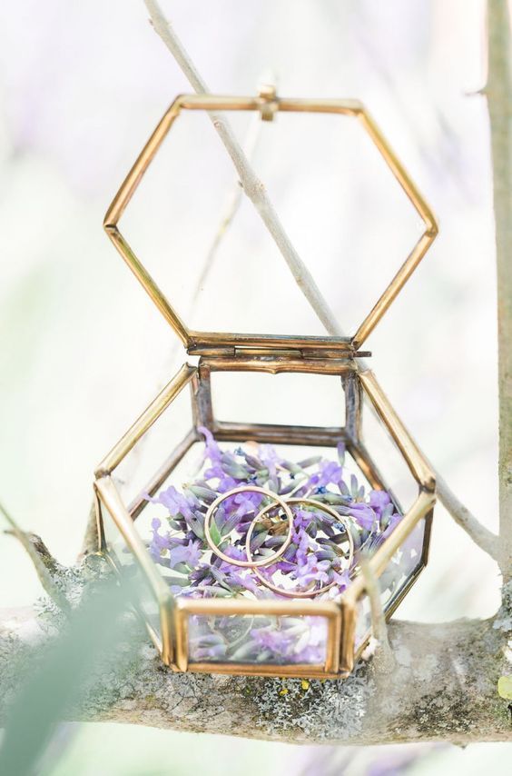 geometric ring box with flowers inside