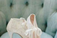 23 vintage ivory lace booties with peep toes and cutouts plus a ribbon bow