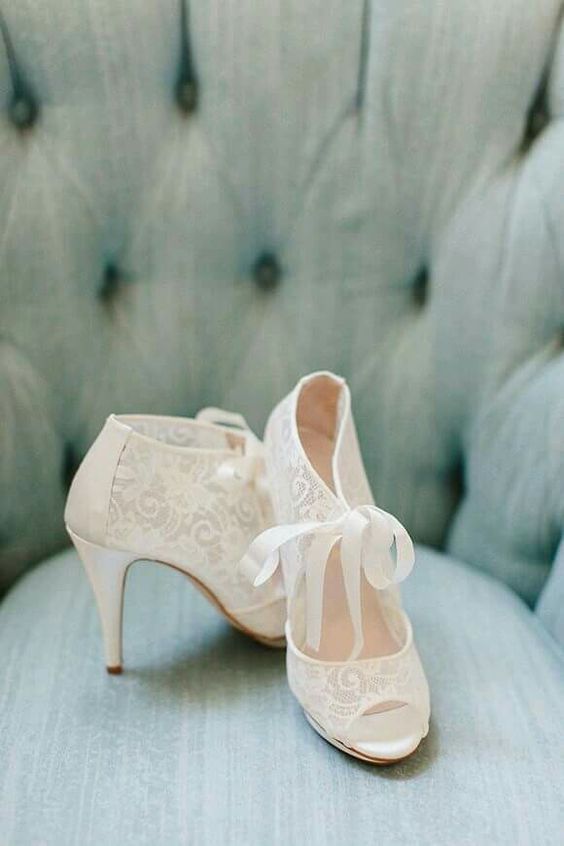vintage ivory lace booties with peep toes and cutouts plus a ribbon bow