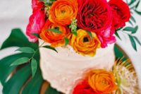 25 dirty icing wedding cake with bold blooms all over