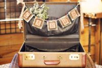 25 vintage suitcase with a garland and baby’s breath