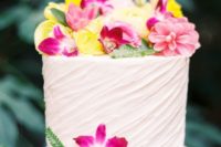 26 draped one-tier wedding cake topped with bold tropical flowers
