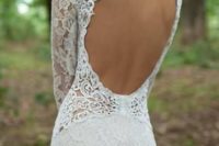 26 lace mermaid wedding dress with sleeves and a circle cutout back