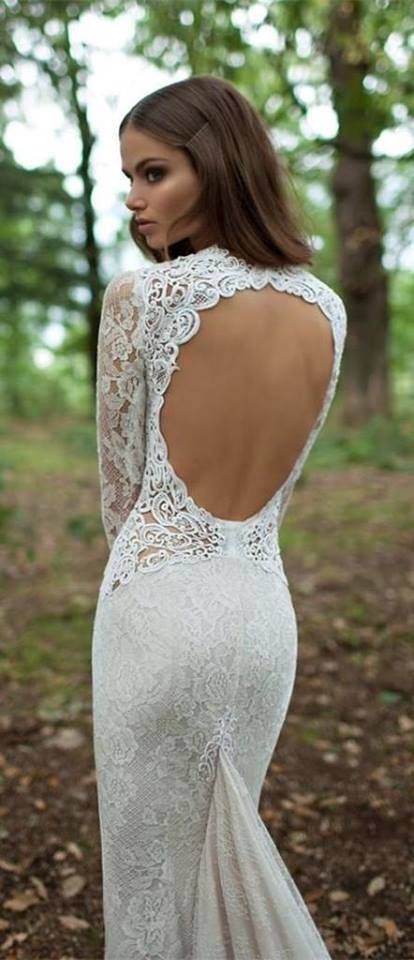 lace mermaid wedding dress with sleeves and a circle cutout back