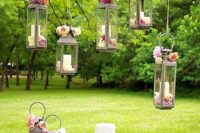 26 sweet wedding cake display with hanging lanterns, pink and blush flowers