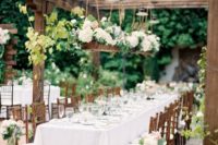 27 outdoor summer garden reception with white flower decorations over the tables
