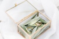 27 small glass and brass ring box with leaves inside