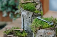27 wood stumps with moss and vintage keys for wedding decor