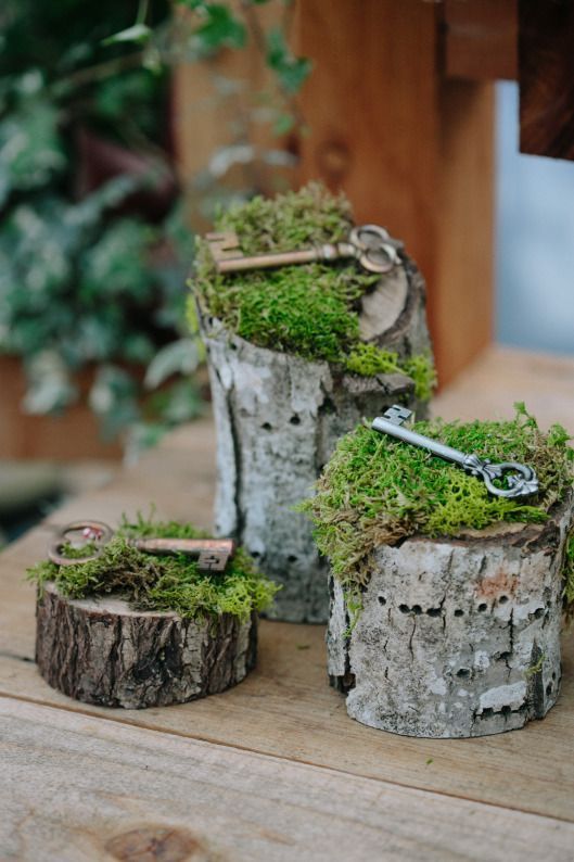 wood stumps with moss and vintage keys for wedding decor