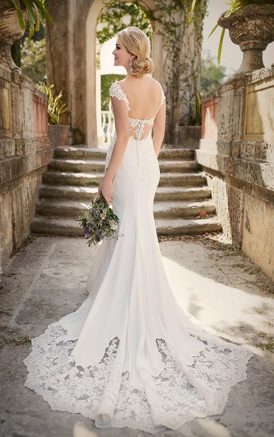 pretty lace cap sleeves, lace back detailing and a U cut, and a scalloped lace cathedral train