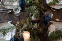 28 wedding tablescape with blue glasses, ferns, succulents and candles