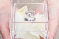 29 a modern acrylic ring box with white flower petals