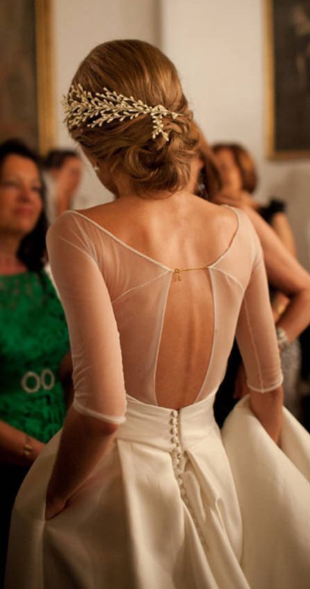 sheer cutout back wedding dress and a row of buttons