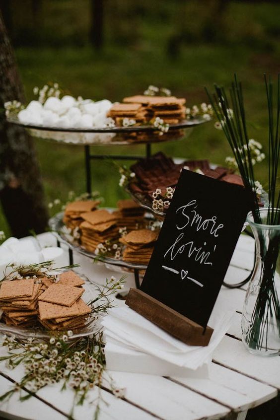 s'mores bar decorated with fresh flowers