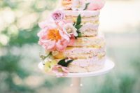30 naked wedding cake topped with pink and peachy flowers