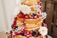 31 naked wedding cake with fresh berries and baby’s breath
