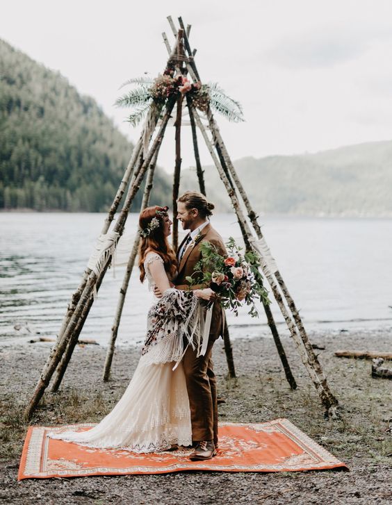 teepee shaped altar of birch branches and flowers