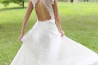 31 triangle cutout back wedding dress, cap sleeves and a long, full skirt