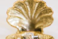 32 a gilded sea shell as a wedding ring box