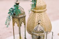 32 an arrangement of Moroccan lanterns with greenery and flowers