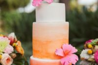 33 peach ombre wedding cake topped with blooms