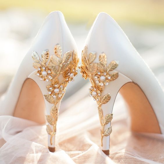 white platform shoes with gold cherry blossoms and pearls look luxurious