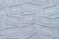 35 acrylic escort cards with laser engraved calligraphy