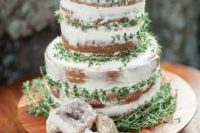 36 a naked wedding cake with fresh greenery and agate slices