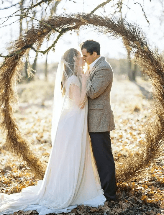 an organic dried herb and foliage giant wreath arch is a hot trend, and will be great for a fall wedding
