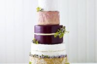 tall cheese tower with greenery and a heart-shaped cheese piece on top