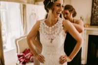 02 The bride chose a soft crochet lace boho sleeveless wedding dress and flowers and greenery in her hair