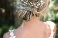 02 a beautiful low bun with twisted hair and a sparkling hair vine look great