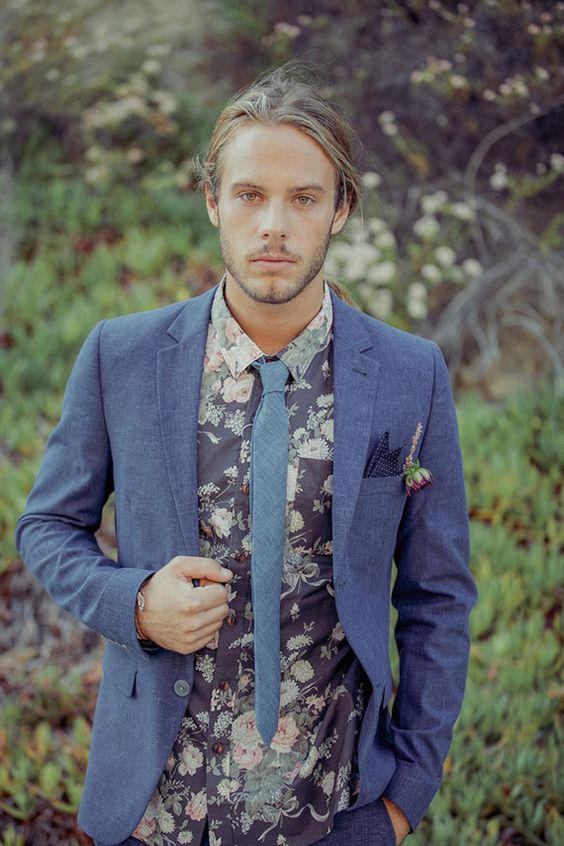 a dark floral shirt, a slate grey jacket and a grey tie for a hippie feel