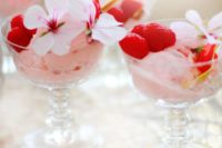 02 strawberry ice cream served topped with raspberries and flowers