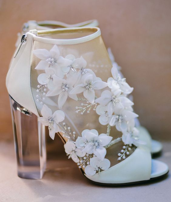 ultra-modern sheer peep toe booties with floral appliques, pearls and lucite heels