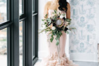 03 The bride chose a stunning blush Holly gown and her bouquet perfectly complemented the look