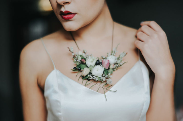 Floral jewelry is one of the hottest trends, and the bride was rocking a gorgeous necklace
